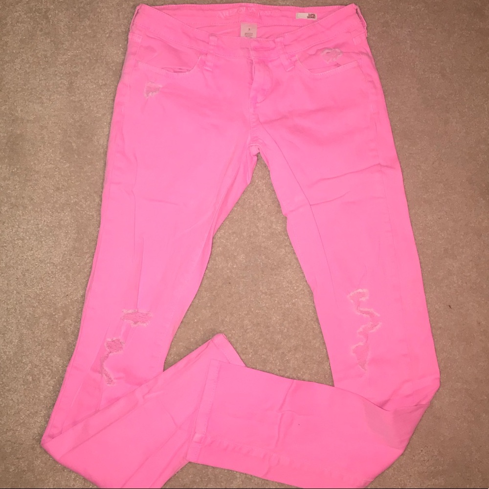 Hot pink destroyed skinny jeans
